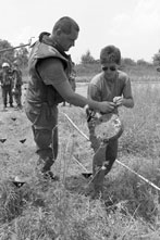 A UN demining team in Lipovac, Croatia locates an active landmine.
